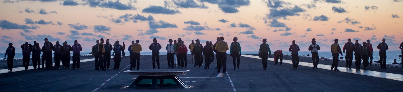 military personnel on aircraft carrier