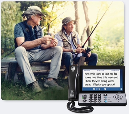 Men fishing and sitting on a log bench with a Hamilton CapTel< 2400i phone in the foreground